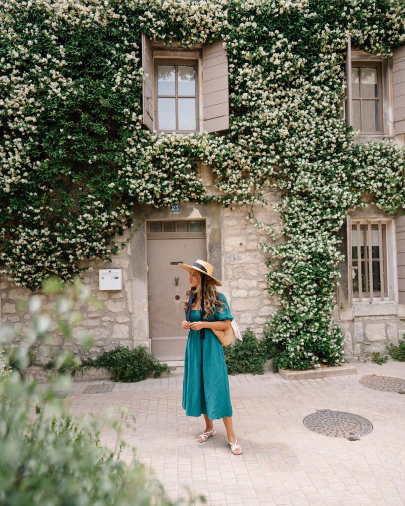 Adrian Maria walking through the streets of Saint Remy de Provence france with jasmine flowers in bloom