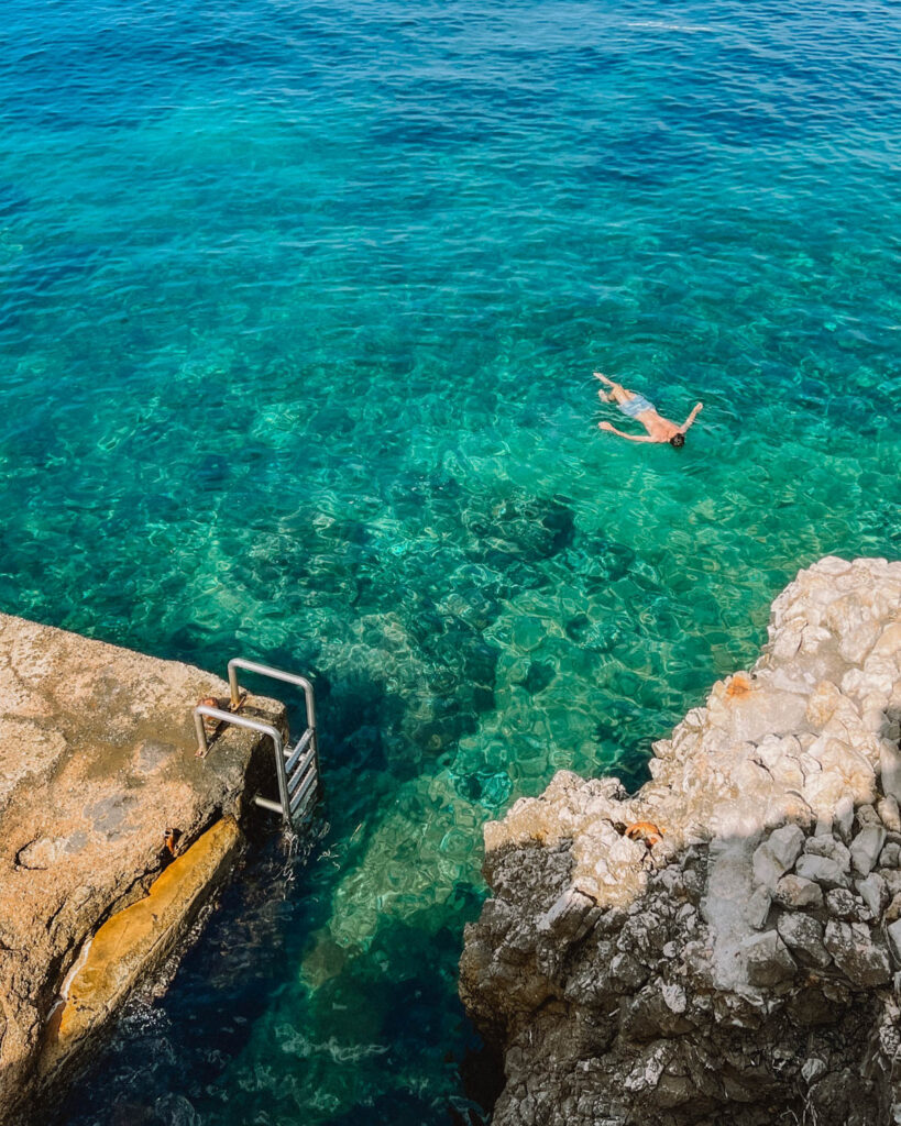 person swimming at Billionaires Bay - Cap d'Antibes on the french riviera