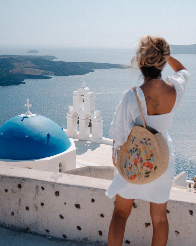 Santorini Blue Domes and three bells of fira view in the greek islands 