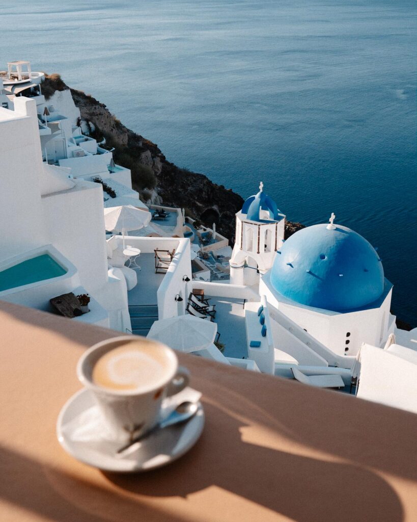 Best Santorini Photos Spots cafe with  blue domes view