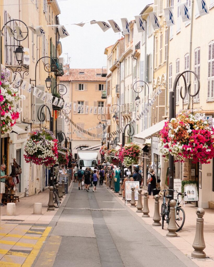 street linned with flowers in Antibes town in the french riviera
