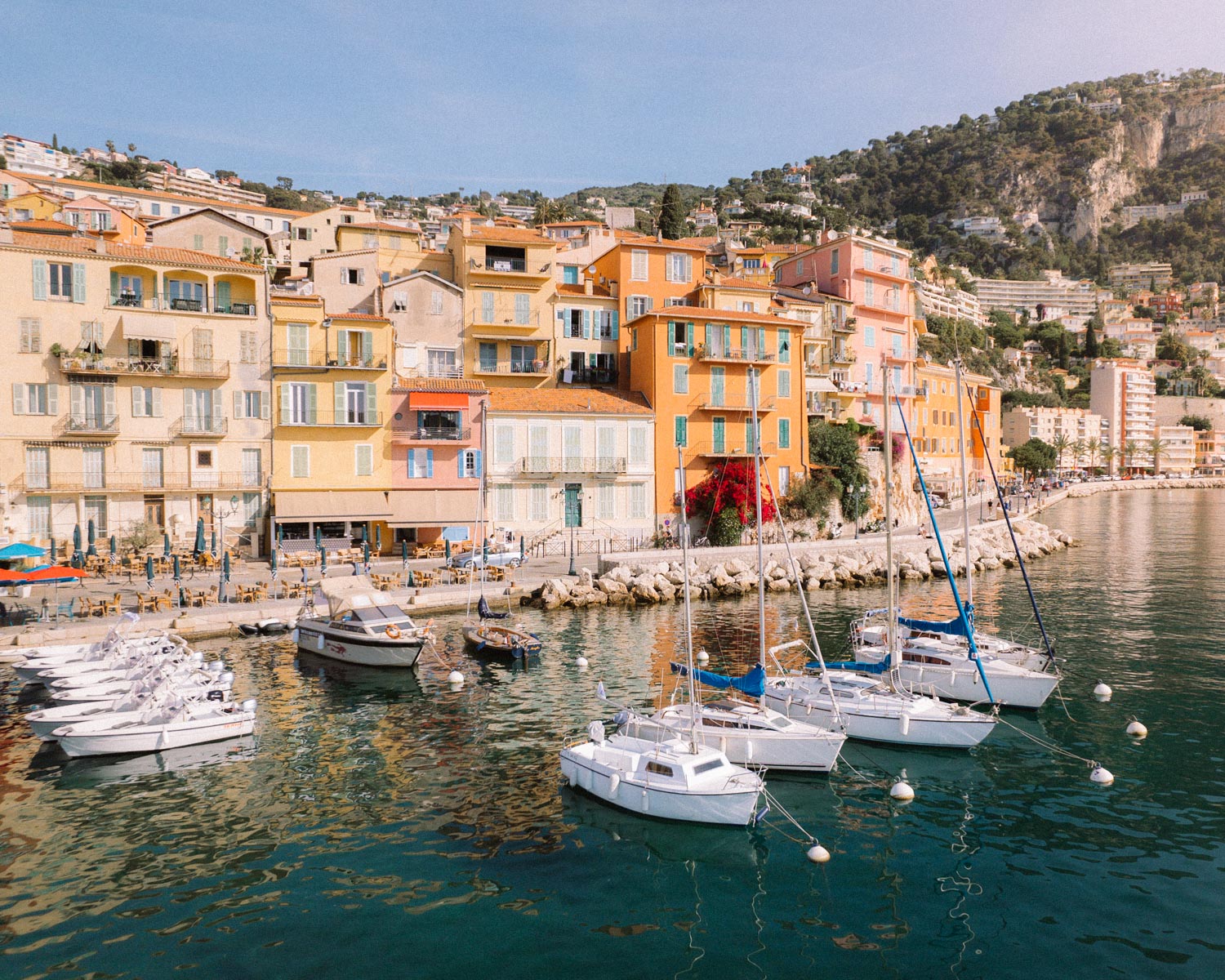 yachts in the harbour with colourfull buildings in Villefranche sur Mer village on the French riviera 