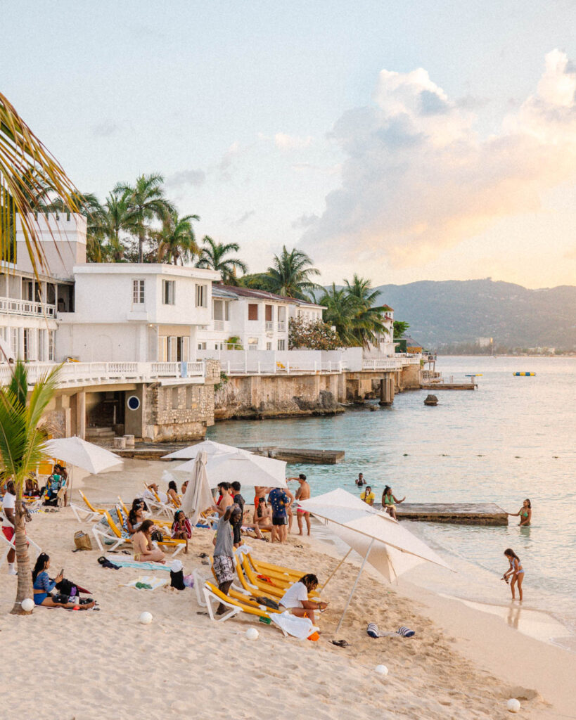 people swimming at sunset at Sea Island Beach Club Montego Bay Jamaica