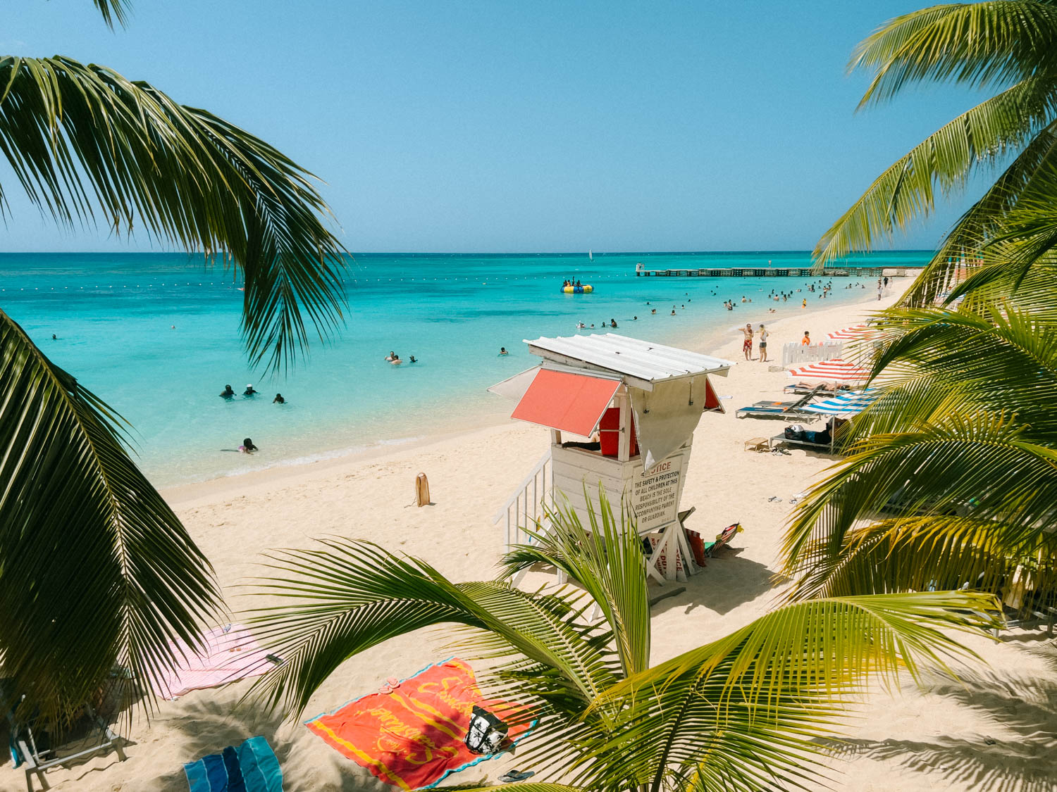 palm trees and white sand beach in montego bay jamaica