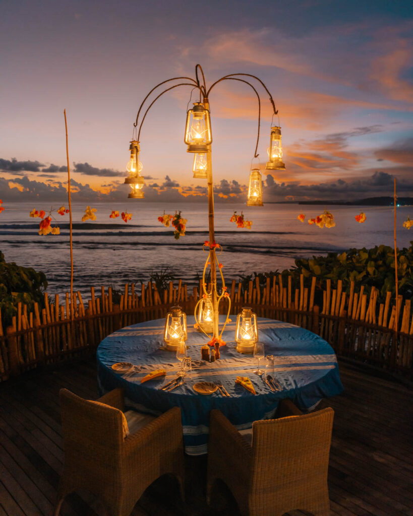 Romantic tropical dinner setting at Ombak restaurant Nihi Sumba resort 