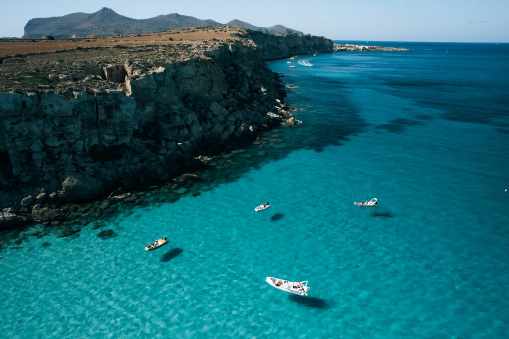 boats bloat on the turquoise waters of Favignana island sicily