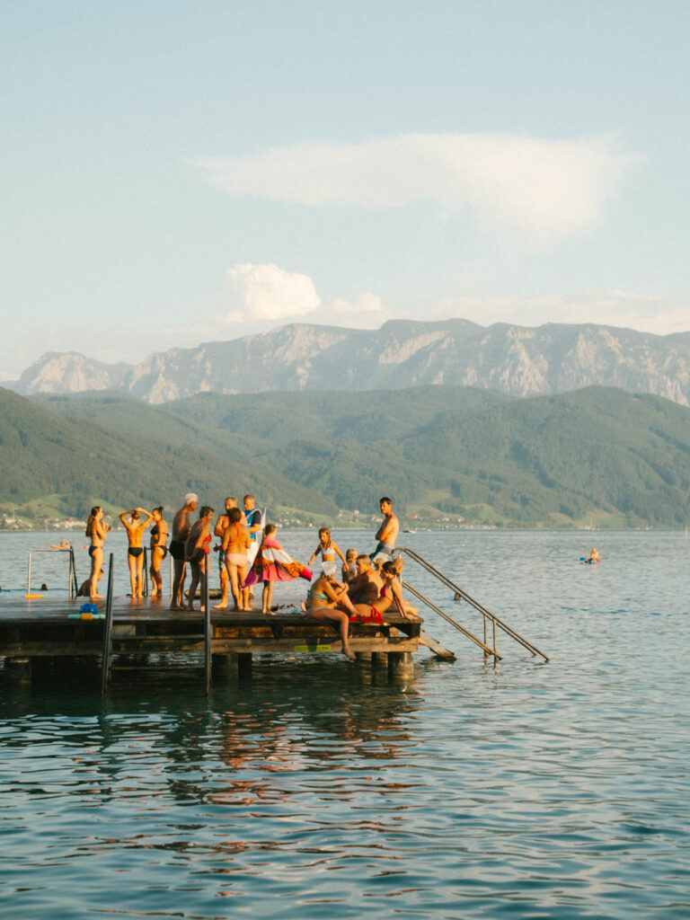 sunbathers at Attersee lake austria in the summer 