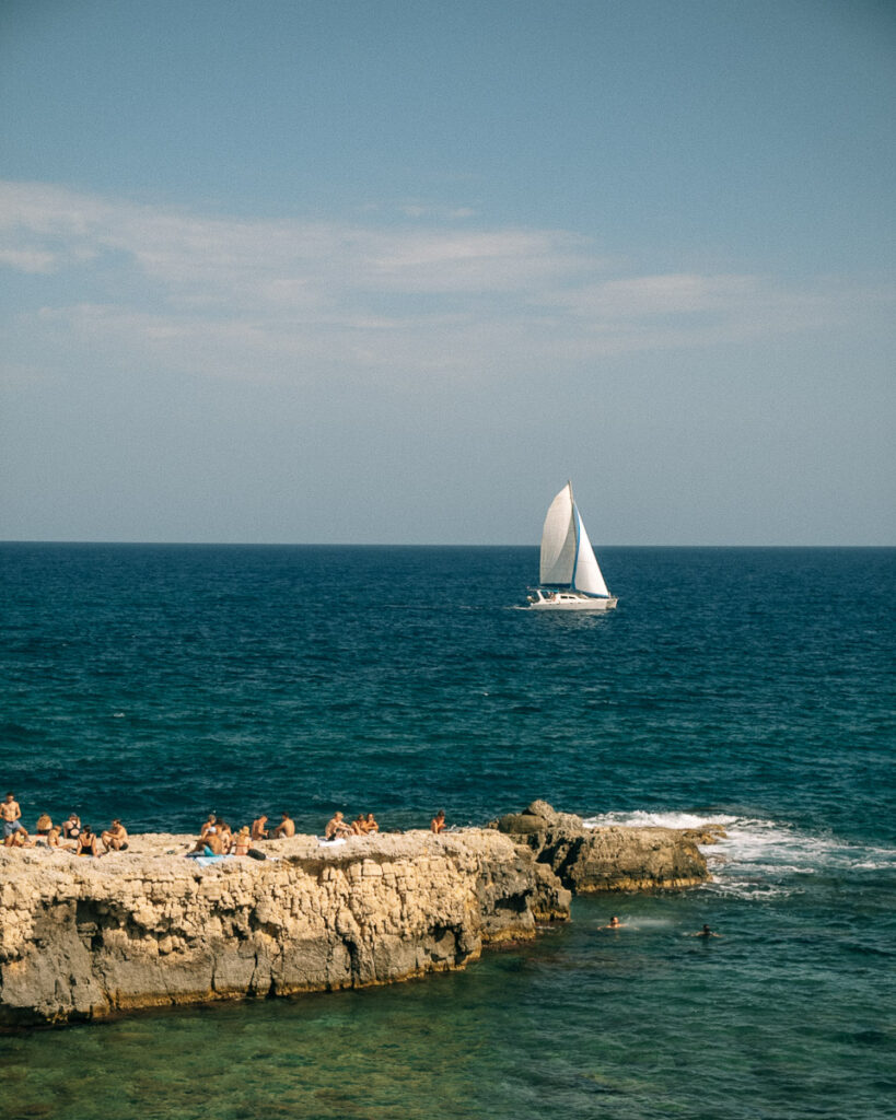 sunbagthers on rocks in Origia Syracuse Sicily