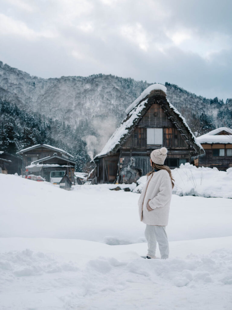 tradtional farmhouse covered in snow japan