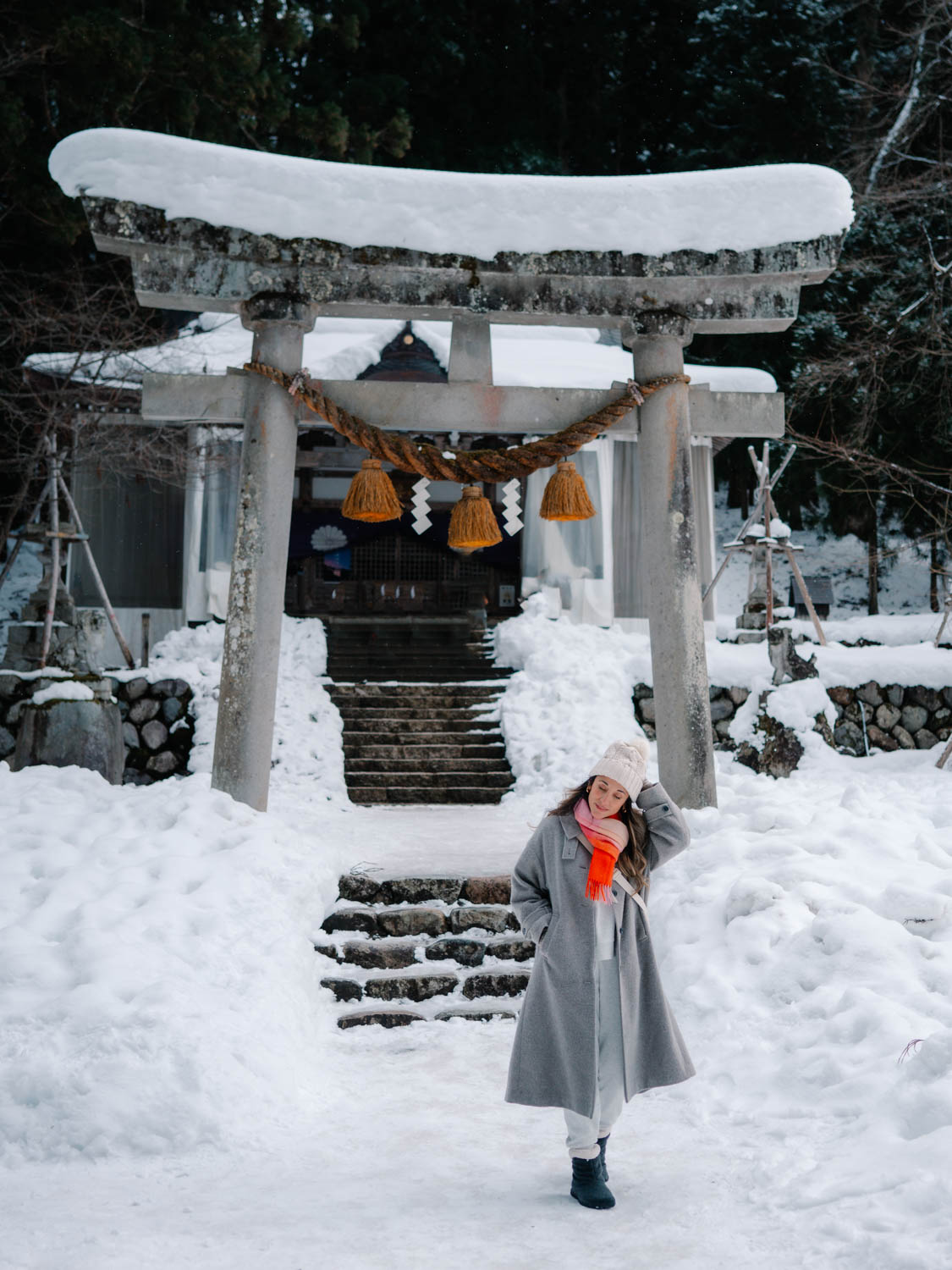 a tori gate covered in thick snow shirakawa village, gifu prefecture Japan